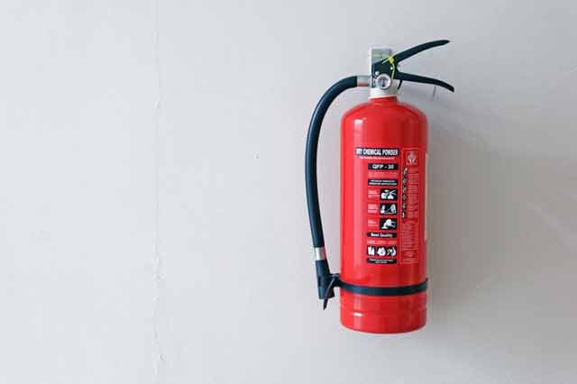 a red ABC fire extinguisher