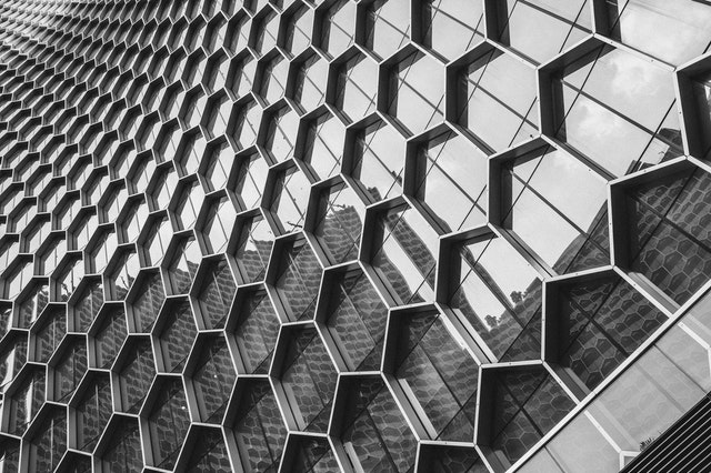 hexagonal arrangement of steel and aluminium on a construction wall which resulted in unique design.